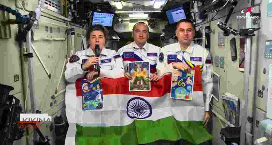 Russian cosmonauts aboard the International Space Station hold the Indian tricolour while extending Independence Day greetings to India.