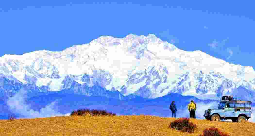 Tourists take a glance of the Kanchenjunga mountains during the Sandakphu trek in the Darjeeling hills in West Bengal.