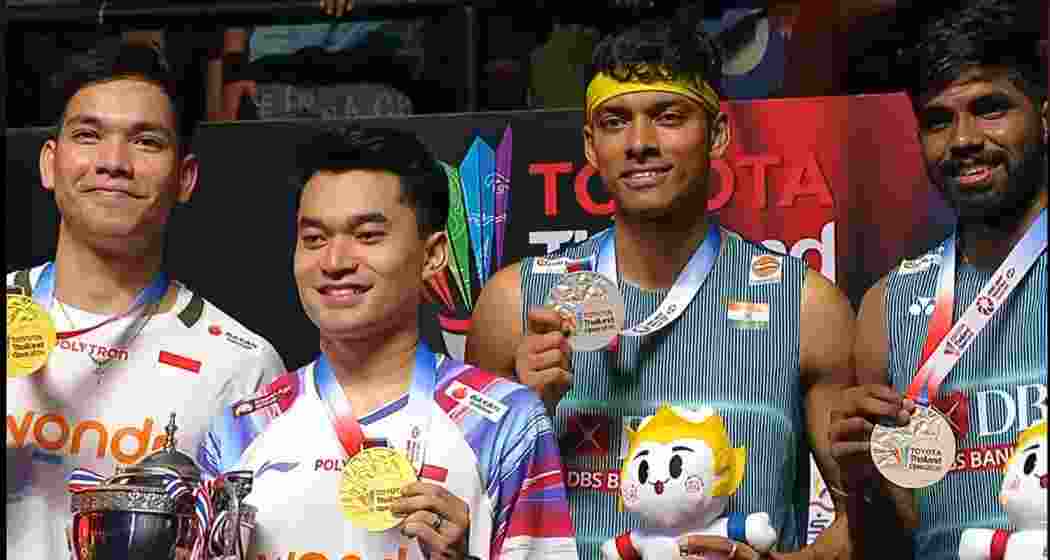 Satwiksairaj Rankireddy and Chirag Shetty, along with Indonesian pair Leo Rolly Carnando and Daniel Marthin, display their medals after the men’s doubles final of the Thailand Open Super 500 in Bangkok, where the Indian duo finished runners-up following a hard-fought contest.