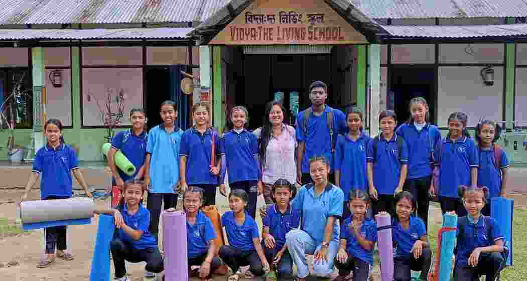 Students of Vidya: The Living School in Assam pose for a photograph after a yoga session on the campus, which provides education and life skills training to children from marginalised communities.