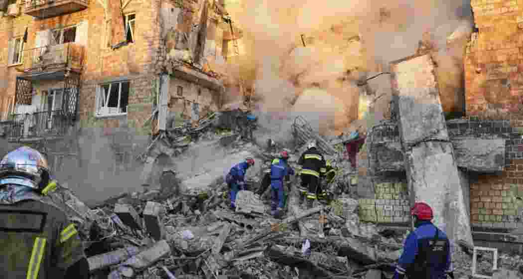 Firefighters engaged in rescue work at a burning building after a Russian attack in Kyiv, Ukraine.
