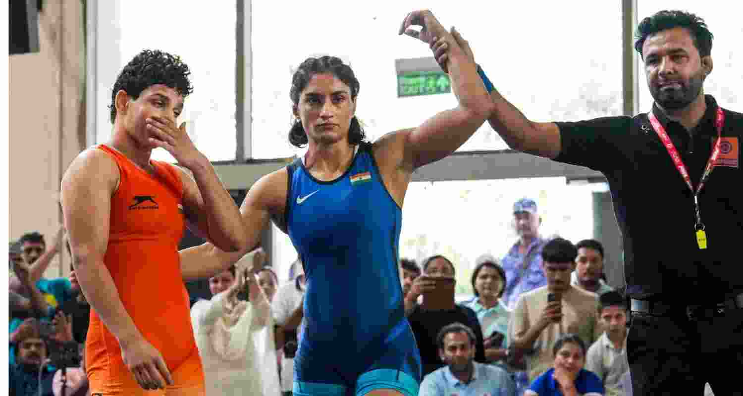 Vinesh Phogat (in blue) won the 53kg category match against Nishu during the Asian Games selection trials in New Delhi on Saturday before losing to Meenakshi Goyat 4-6 in the semifinal.