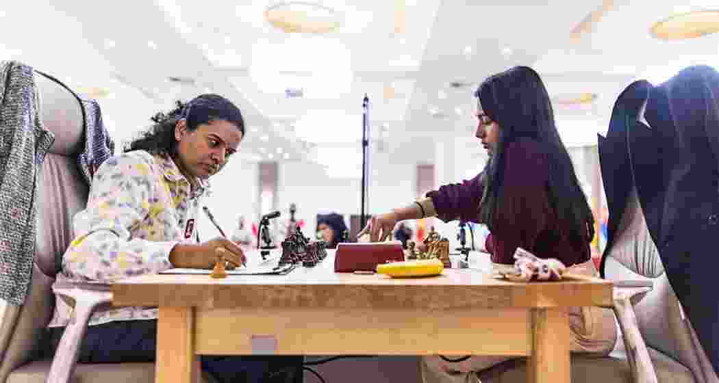 Divya Deshmukh and Koneru Humpy during Game 1 of the Women’s World Cup final in Germany on Saturday, which ended in a draw after a tense 41-move tactical showdown. Divya Deshmukh and Koneru Humpy during Game 1 of the Women’s World Cup final in Germany on Saturday, which ended in a draw after a tense 41-move tactical showdown.