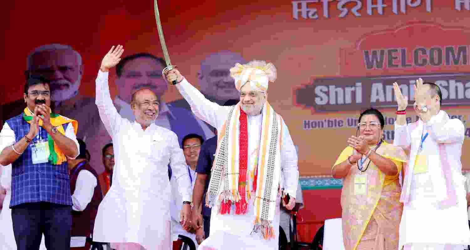 Union Minister and BJP leader Amit Shah holds a sword during a public rally ahead of Lok Sabha polls in Imphal, Manipur on Monday. Union Minister and BJP leader Amit Shah holds a sword during a public rally ahead of Lok Sabha polls in Imphal, Manipur on Monday.
