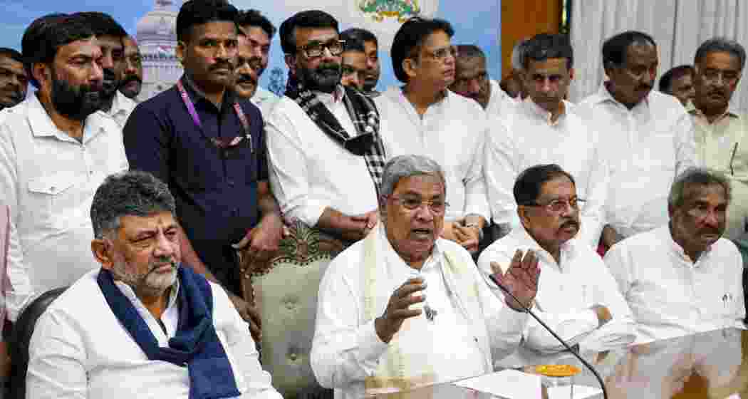  Karnataka Chief Minister Siddaramaiah addresses a press conference after announcing his resignation, in Bengaluru, Thursday, May 28, 2026. Deputy Chief Minister DK Shivakumar and senior Congress leaders are also seen. (PTI Photo/Shailendra Bhojak)