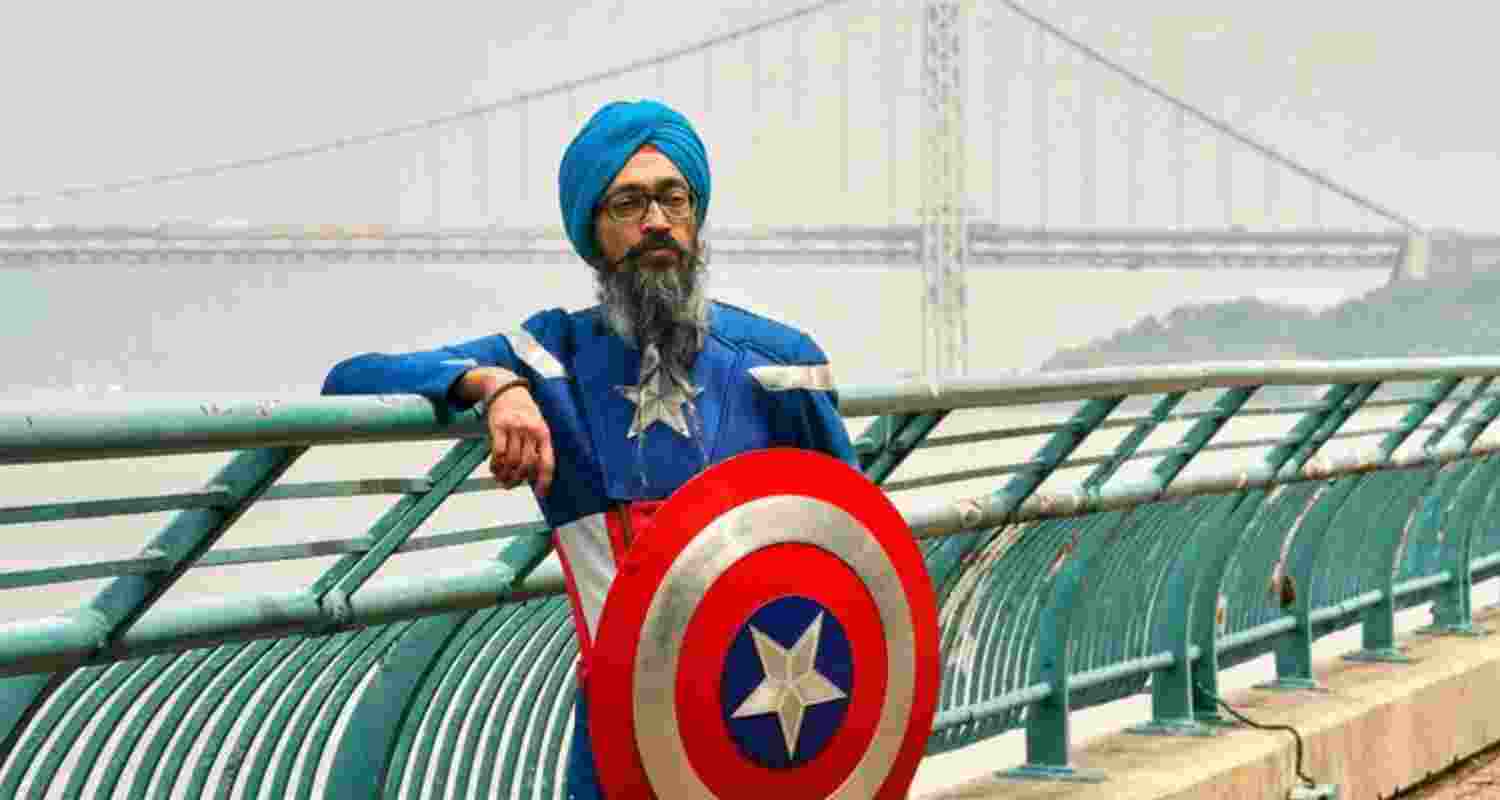 Vishavjit Singh, who uses his Captain Sikh America persona to teach youth about Sikhism, poses in costume for a portrait at Riverbank State Park in New York’s Harlem neighbourhood.