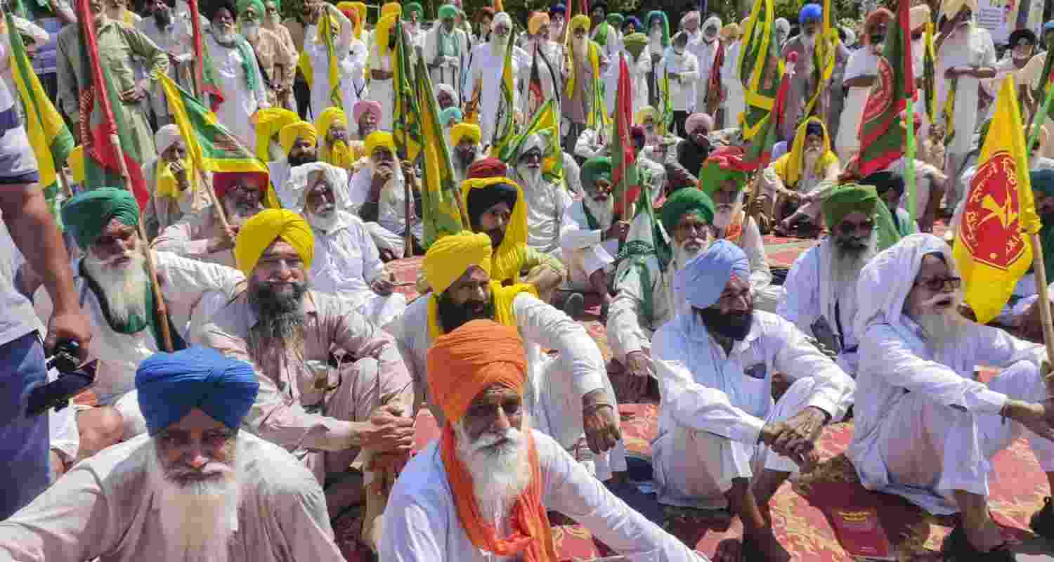 Farmers block a road as they stage a protest against the central government over various pending demands, in Patiala, Punjab, Tuesday, June 2, 2026. 