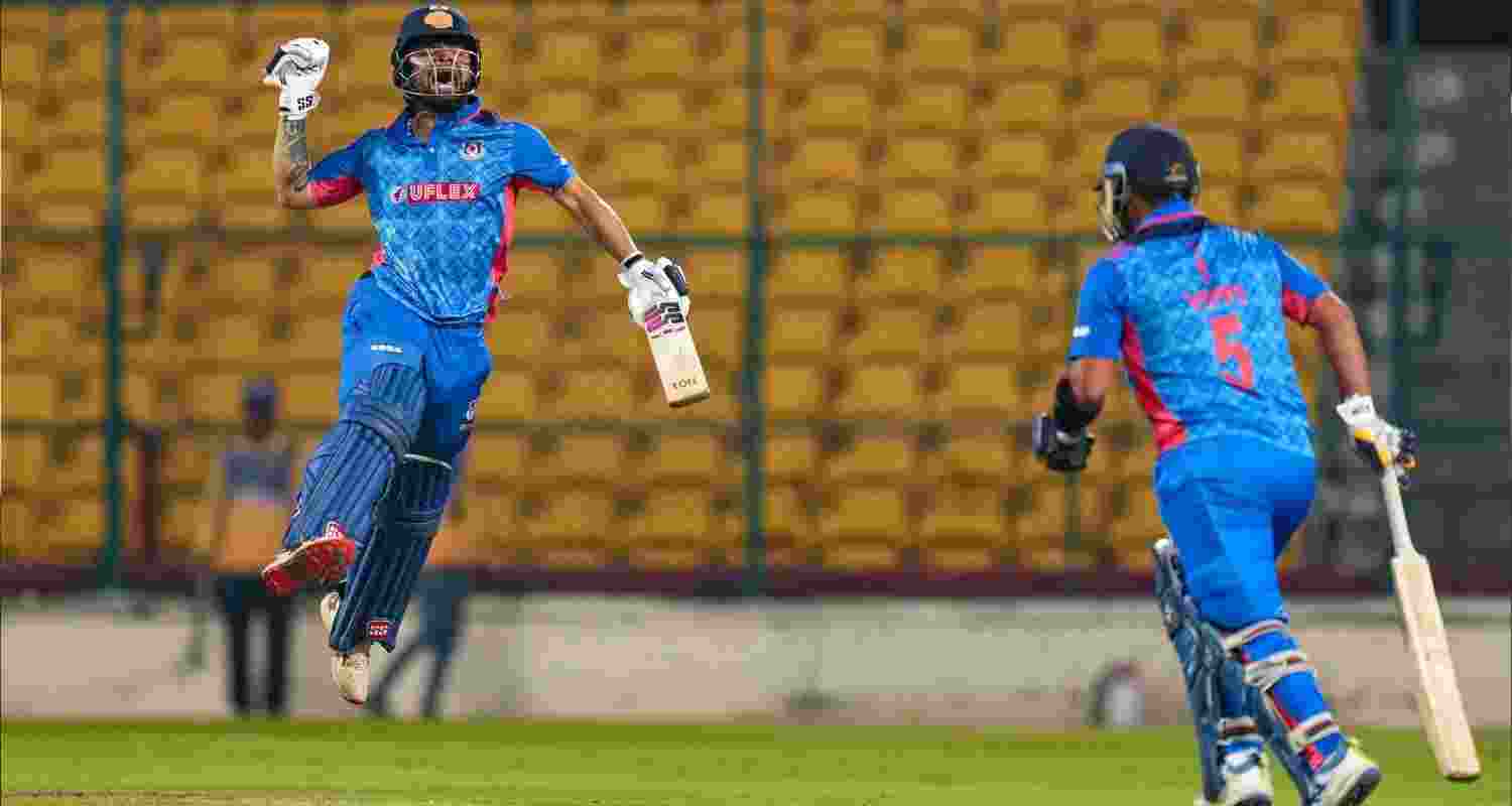 Rinku Singh and Vipraj Nigam celebrate after defeating Andhra Pradesh by 4 wickets.