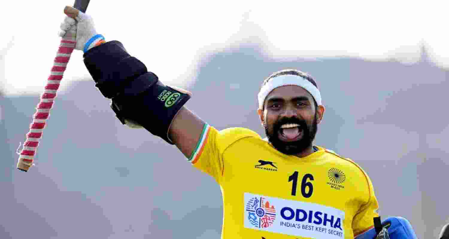 Sreejesh celebrates saving a goal in  a match.