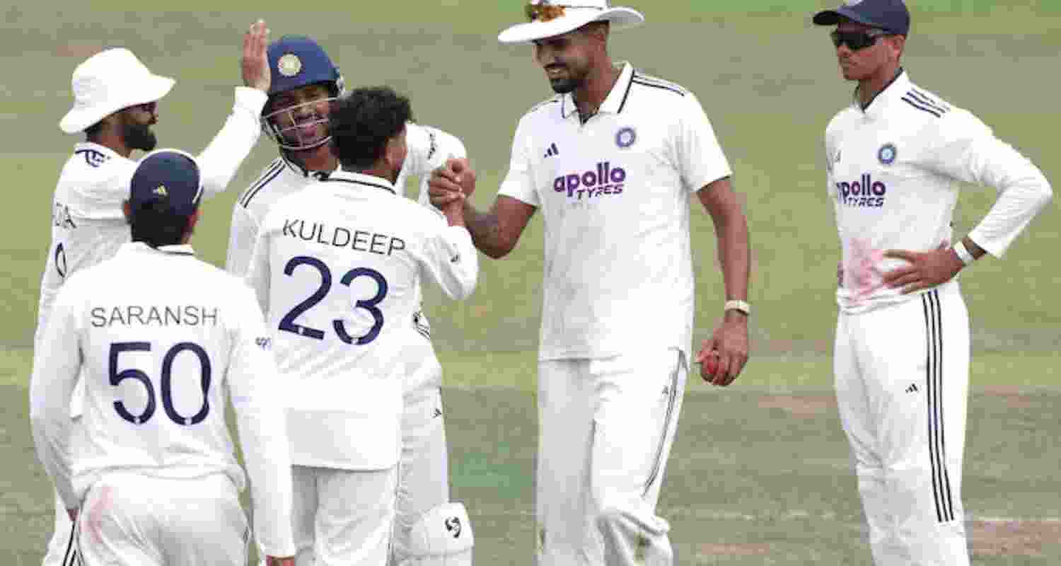 Teammates congratulating spinner Kuldeep Yadav after he found his rhythm and bagged two wickets.