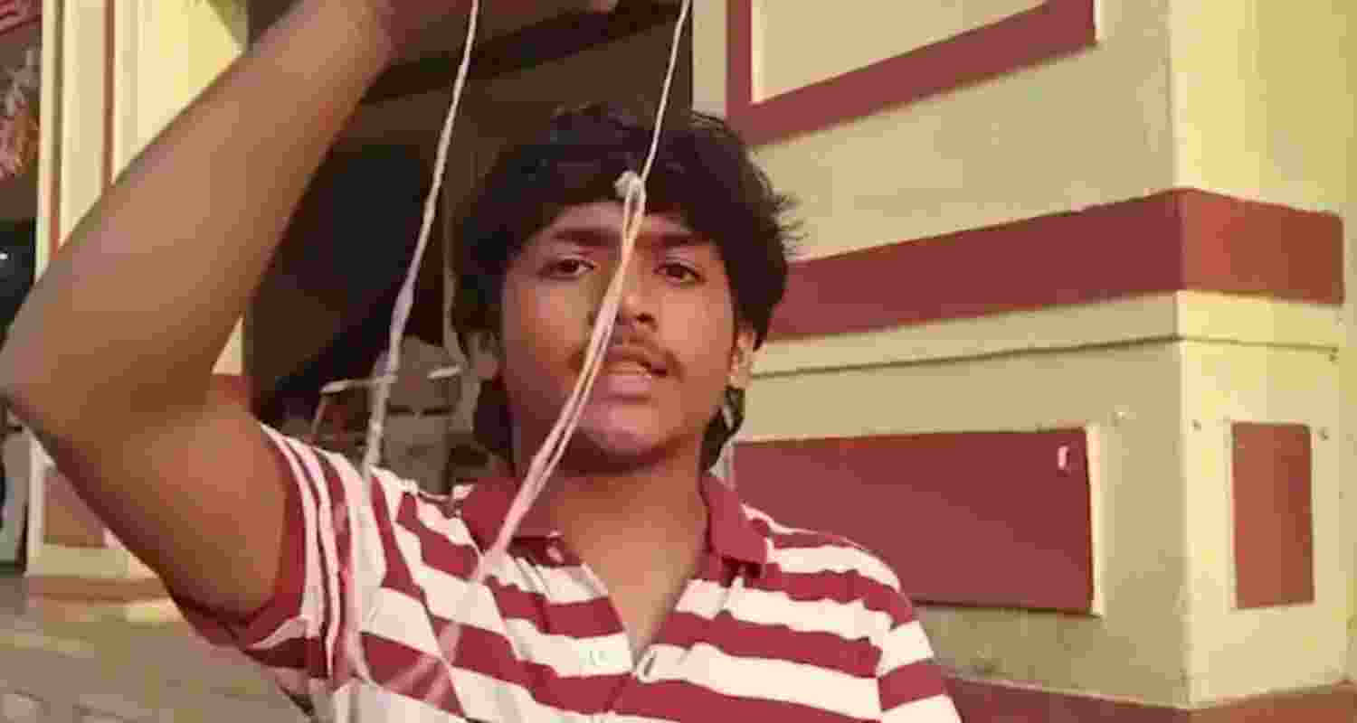 Student Partha Rao showing his janivara after he picked it up from the dustbin. Student Partha Rao showing his janivara after he picked it up from the dustbin.