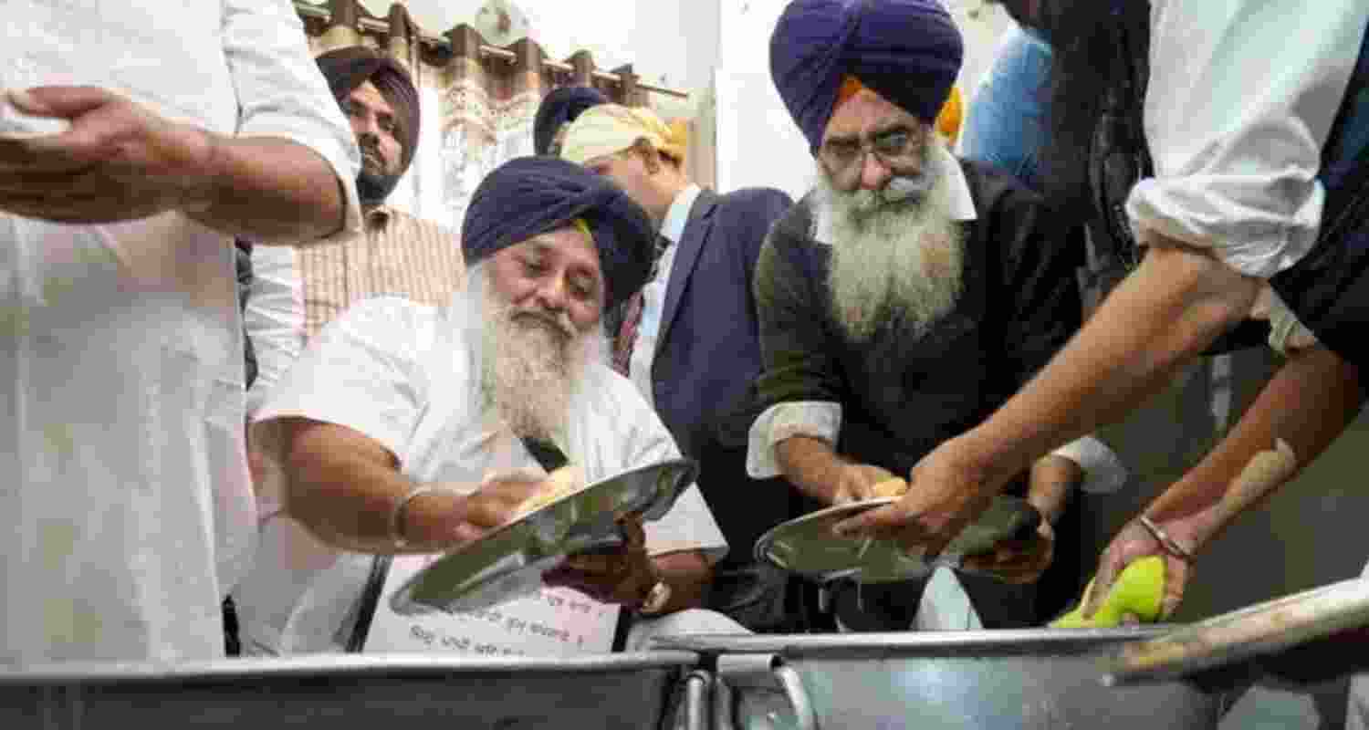 Shiromani Akali Dal leader, Sukhbir Singh Badal performing 'sewa'.