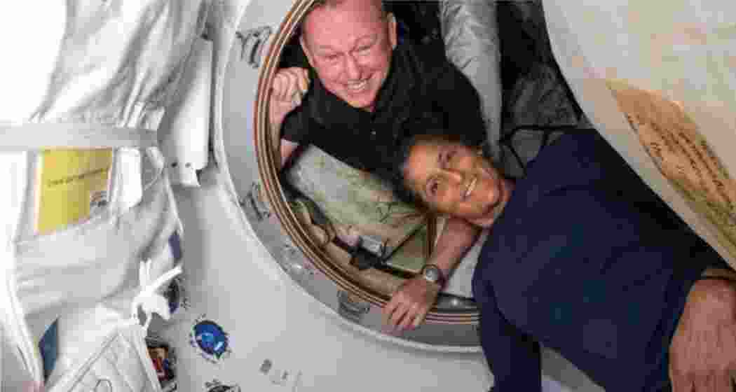 NASA’s Boeing Crew Flight Test astronauts (from top) Butch Wilmore and Suni Williams inside the vestibule between the forward port on the International Space Station’s Harmony module and Boeing’s Starliner spacecraft. 