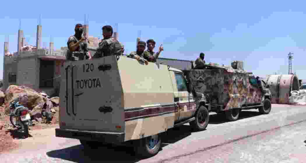 Syrian government security forces gather on the outskirts of Sweida province where clashes erupted between Druze militias and Sunni Bedouin clans, southern Syria, Monday, July 14, 2025.