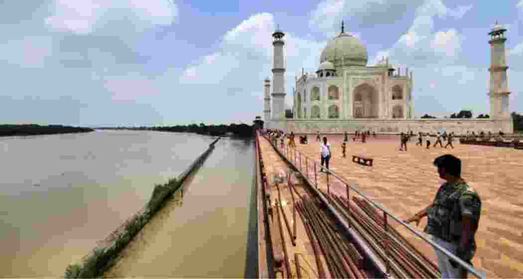 Flood-swollen Yamuna waters reach the walls of the Taj Mahal in Agra.