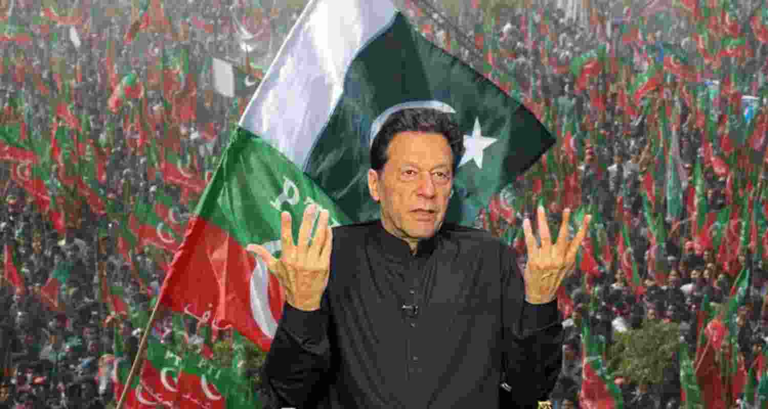 Pakistan's former Prime Minister Imran Khan shrugs his shoulders during a press conference.