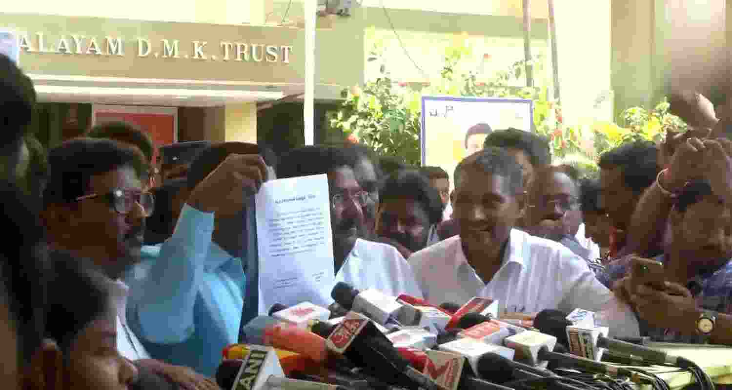 VCK chief Thol. Thirumavalavan displays the letter of seat-sharing arrangement. 