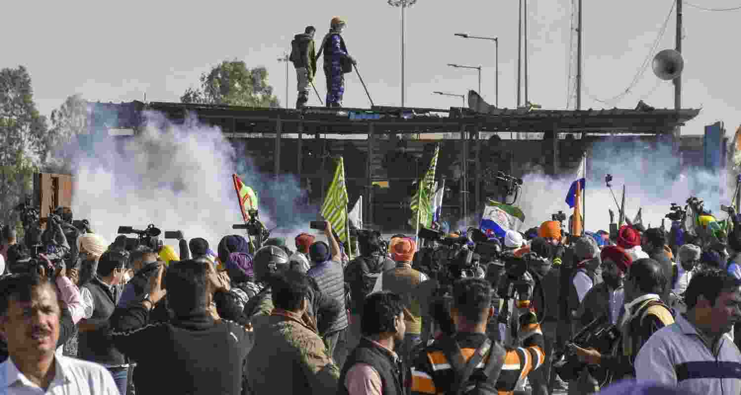 Tear gas being used by security personnel to disperse the farmers moving towards barricades during their foot march to Delhi, at Shambhu border in Patiala district, Punjab, Friday.