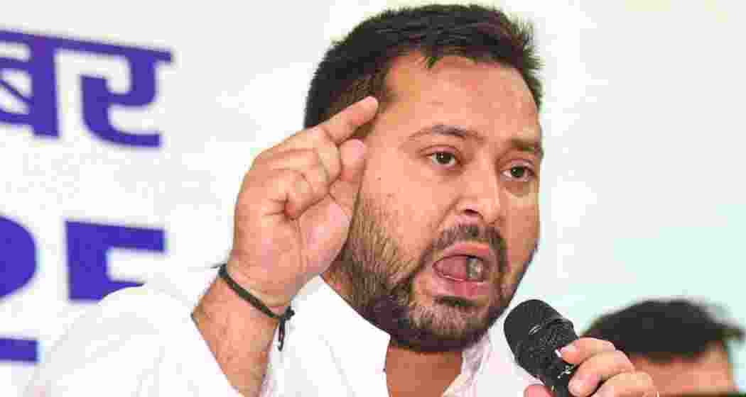 RJD leader and former deputy chief minister Tejashwi Yadav addresses supporters during a press conference in Bihar.