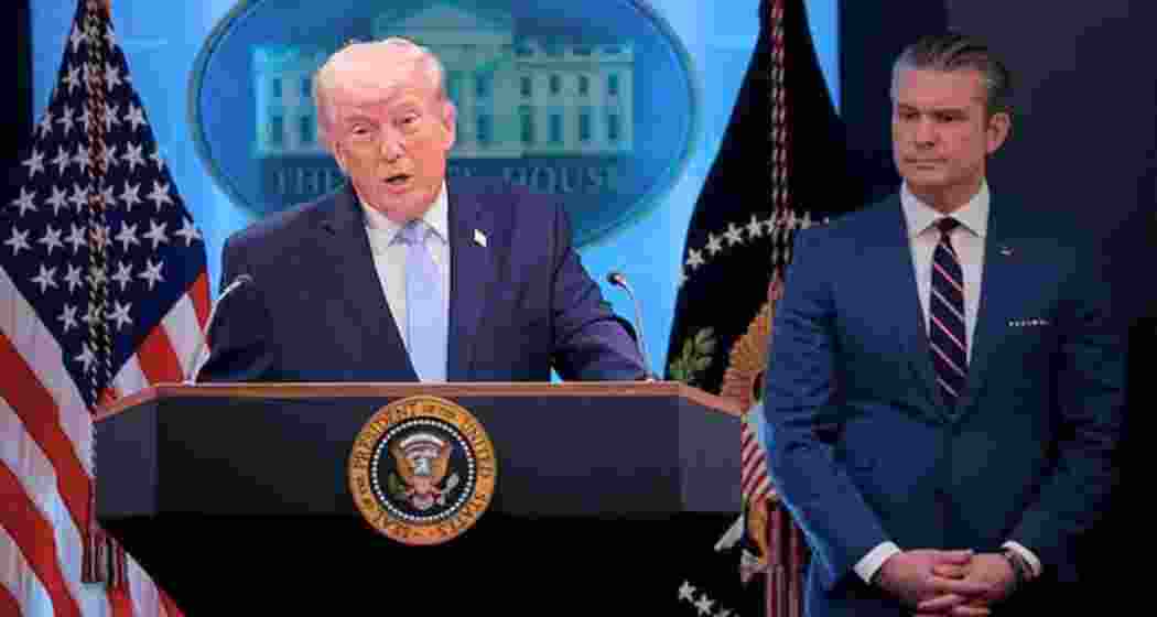 US President Donald Trump with Defence Secretary Pete Hegseth at a press conference.