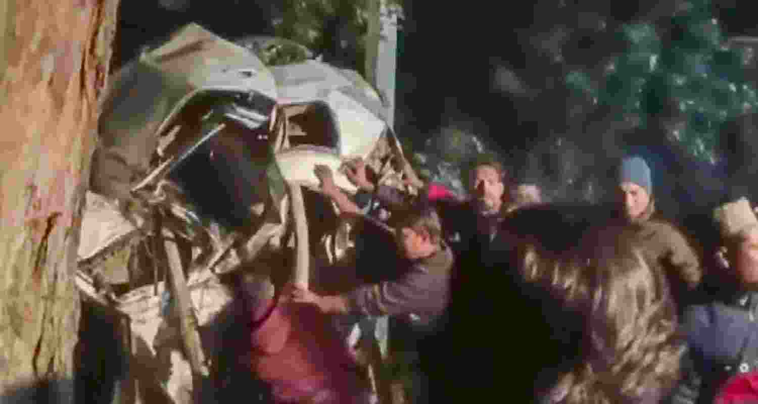 Rescue work underway after a car crashed into a tree, in Pilibhit, Uttar Pradesh.