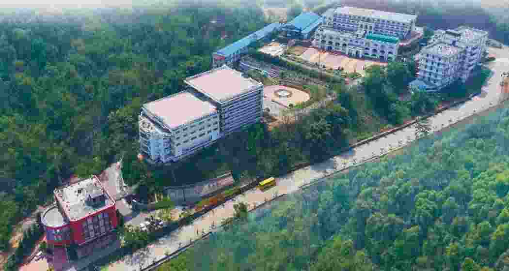 An aerial view of the USTM campus spread across dense forest in Meghalaya’s Ri-Bhoi district.
