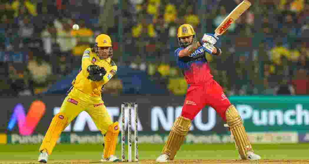 RCB’s star batter Virat Kohli in action during an IPL clash against Chennai Super Kings, as MS Dhoni, behind the stumps, keeps a close eye on proceedings.