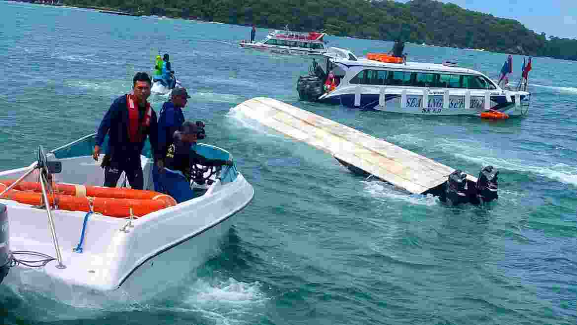 Rescue personnel carry out search and rescue operations after a tourist boat carrying Indian nationals capsized near Vietnam's Phu Quoc Island on Saturday, leaving at least 15 people dead.