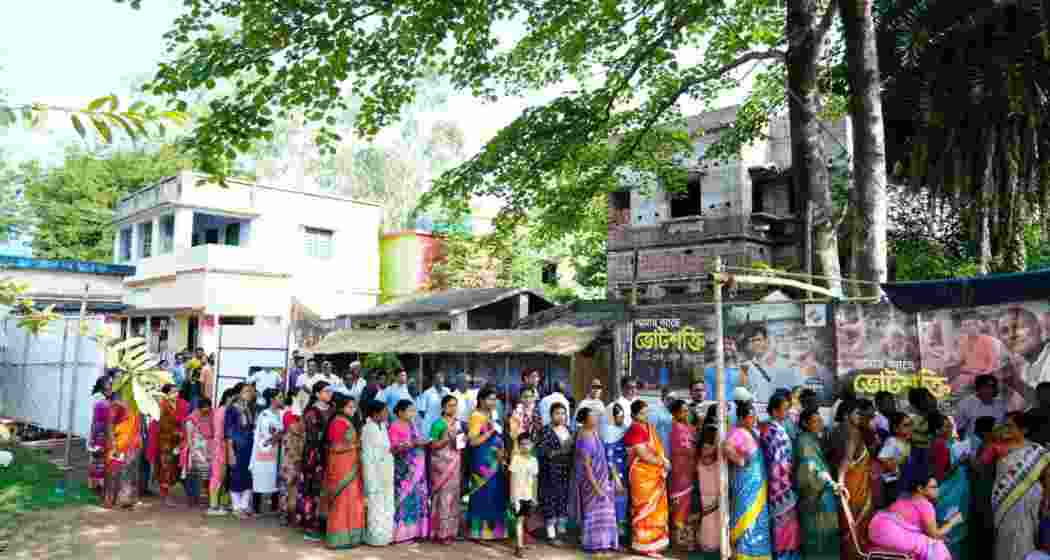 People stand in a queue waiting for their turn to vote at a polling station in West Bengal's Bankura district. People stand in a queue waiting for their turn to vote at a polling station in West Bengal's Bankura district.