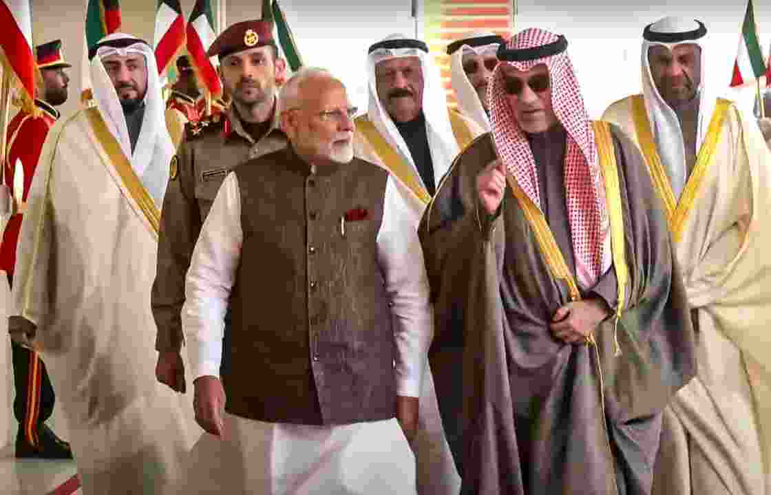 Prime Minister Narendra Modi being with others upon his arrival at the airport, in Kuwait, Saturday.