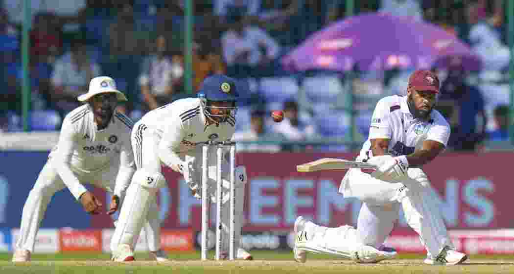 West Indies' John Campbell plays a shot on day three of the second and final Test cricket match of a series between India and West Indies, in New Delhi oon Sunday.