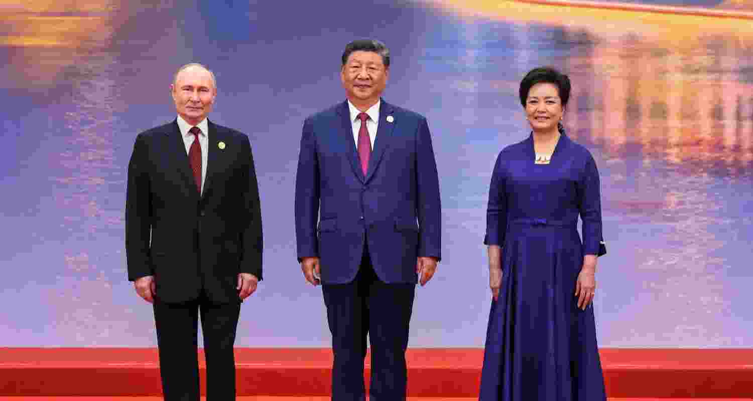 Chinese President Xi Jinping, center, and his wife Peng Liyuan, right pose with visiting Russian President Vladimir Putin, left, during a ceremony to welcome heads of state at the Shanghai Cooperation Organization (SCO) summit in Tianjin, China.