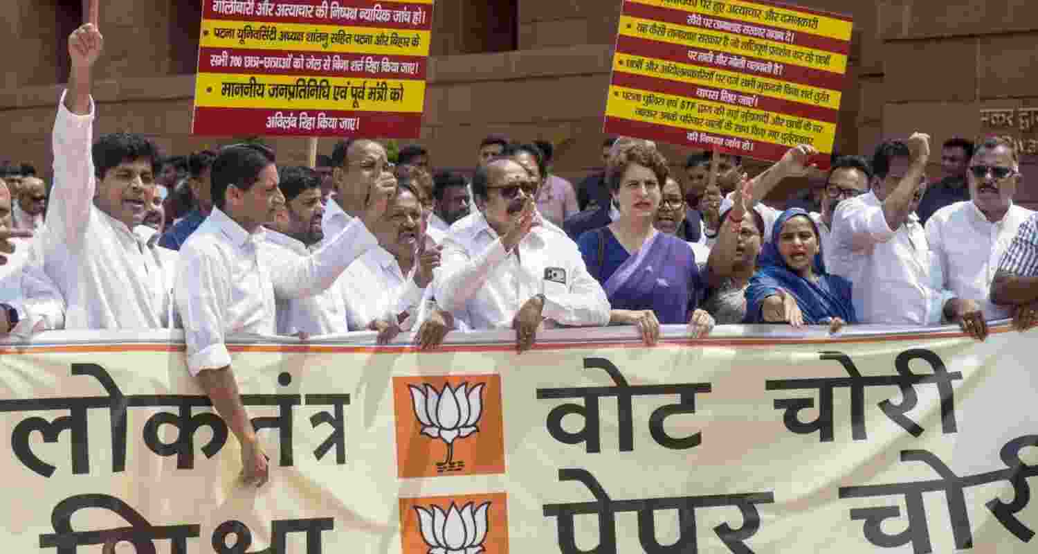Congress MPs led by Priyanka Gandhi Vadra staging a protest in the Parliament House complex over the police action against students during the agitation over the NEET paper leak issue, on Monday. 
