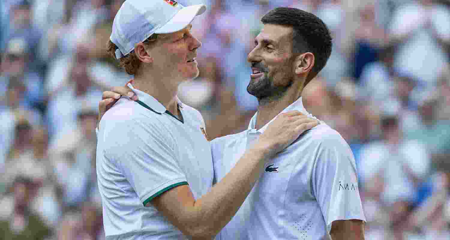 Defending champion Jannik Sinner with Novak Djokovic after the match. 