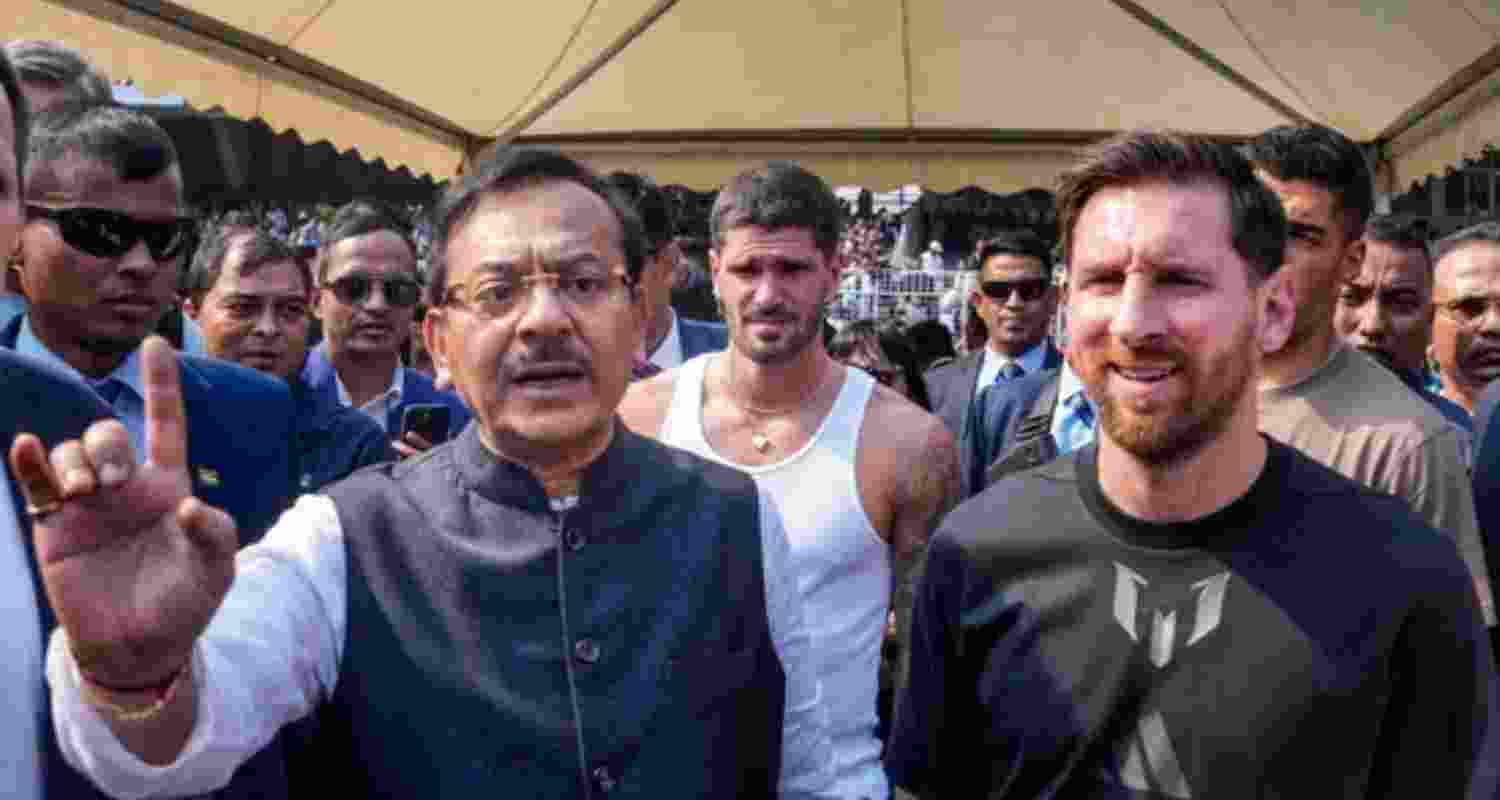 Argentine footballer Lionel Messi with West Bengal Sports Minister Aroop Biswas during an event as part of his 'G.O.A.T. India Tour 2025' in Kolkata.
