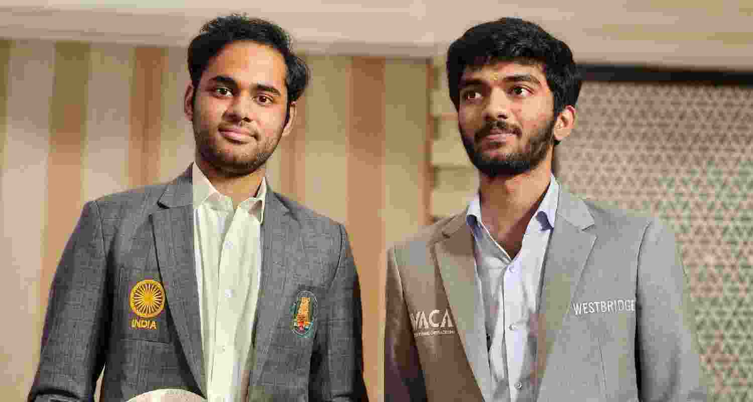  Arjun Erigaisi and (right) D Gukesh.