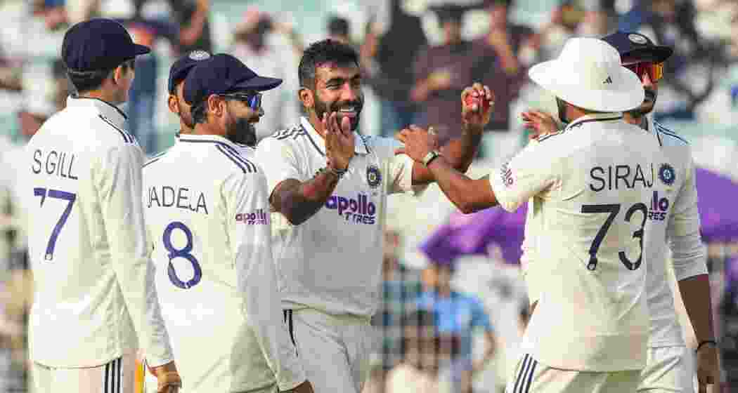 India's Jasprit Bumrah celebrates with teammates after taking his fifth wicket during the first day of the first Test cricket match between India and South Africa, at the Eden Gardens, in Kolkata on Friday. India's Jasprit Bumrah celebrates with teammates after taking his fifth wicket during the first day of the first Test cricket match between India and South Africa, at the Eden Gardens, in Kolkata on Friday.