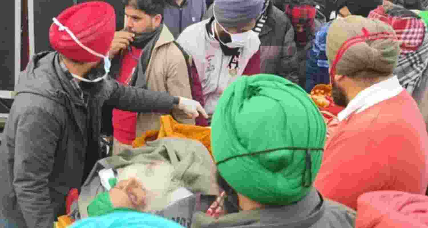 Farmer leader Jagjit Singh Dallewal being carried to an ambulance at Khanauri border in Patiala.
