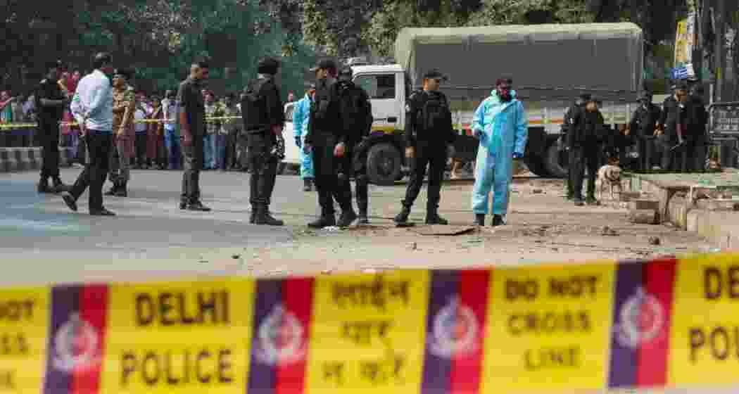 National Security Guard (NSG) personnel inspect the site after the blast in Rohini area of New Delhi. (Photo: PTI)