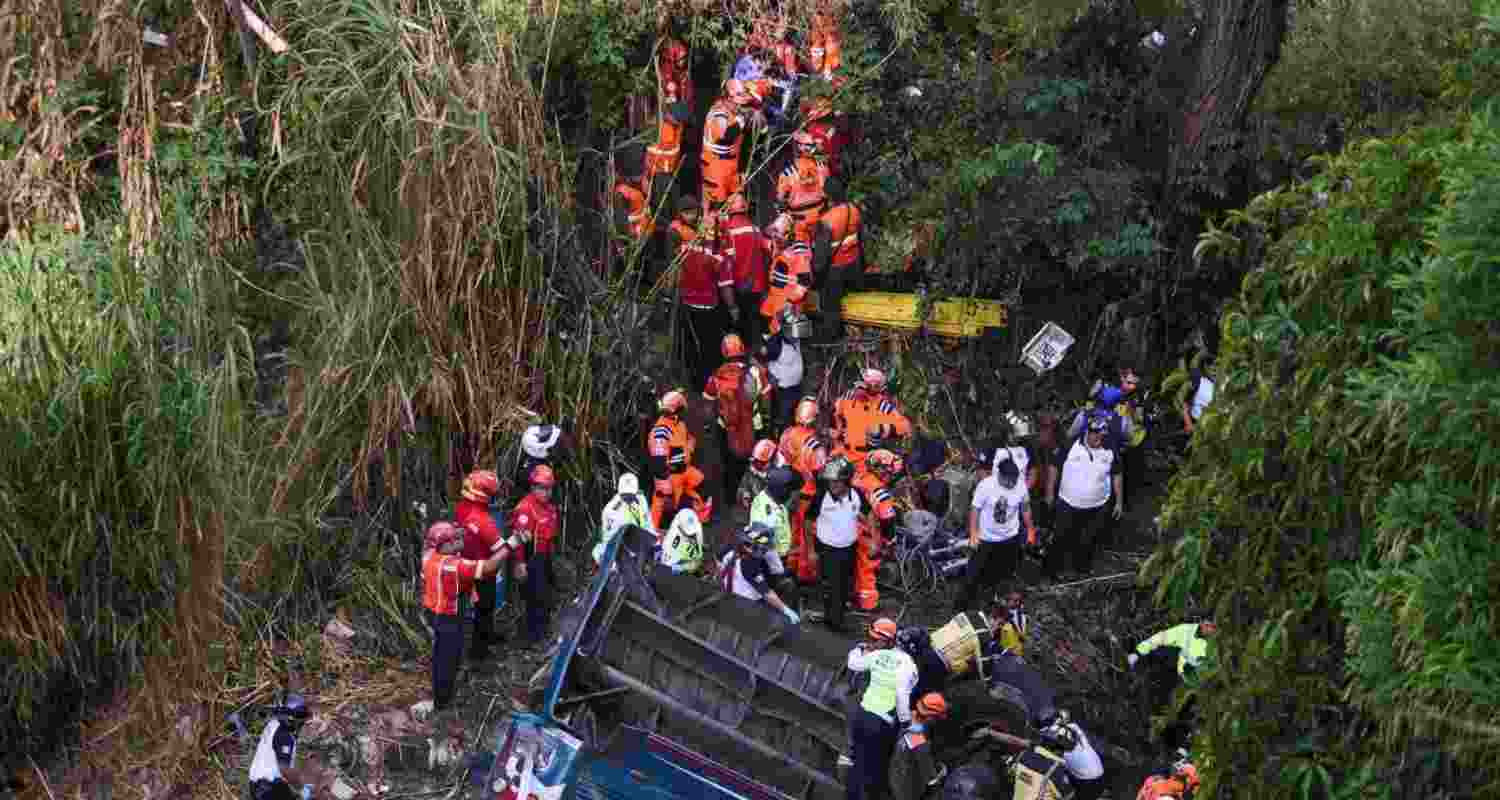 Rescue personnel around the bus that fell over 100 feet into a gorge near Guatemala city, Guatemala. Image via X.