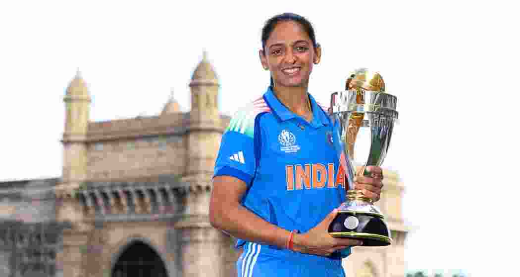 India captain Harmanpreet Kaur holds the World Cup trophy.