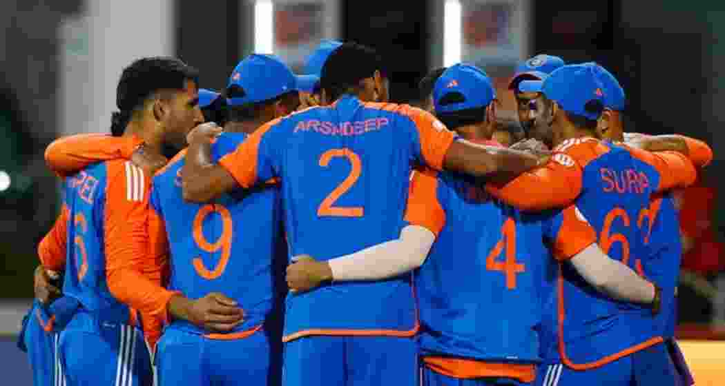 Indian cricket team players gather for a discussion during a match. Indian cricket team players gather for a discussion during a match.