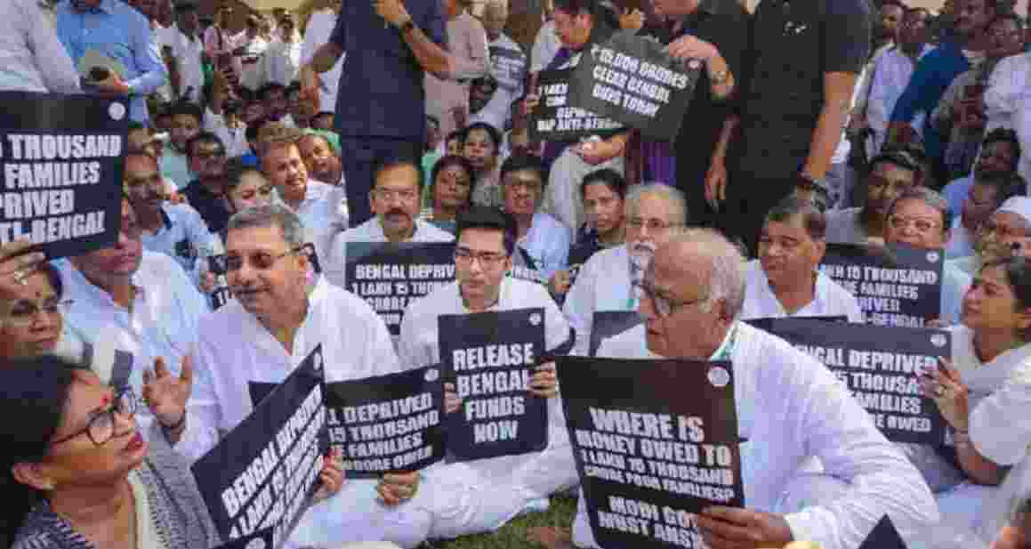 Trinamool Congress leader Abhishek Banerjee along with party workers and leaders sat on a dharna demanding release of funds for West Bengal by the Centre - Image via X.