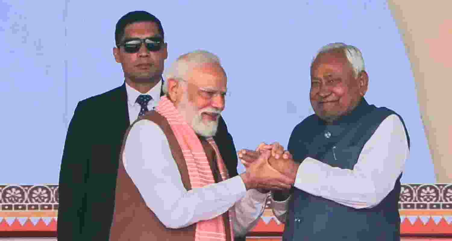 JD(U) supremo Nitish Kumar waves to the gathering during his swearing-in ceremony as the Chief Minister of Bihar, at Gandhi Maidan in Patna, Thursday.
