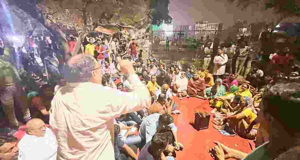 AAP workers and local residents protest near Satpula DDA Park over the halted setup of a Chhath ghat for upcoming festival celebrations.