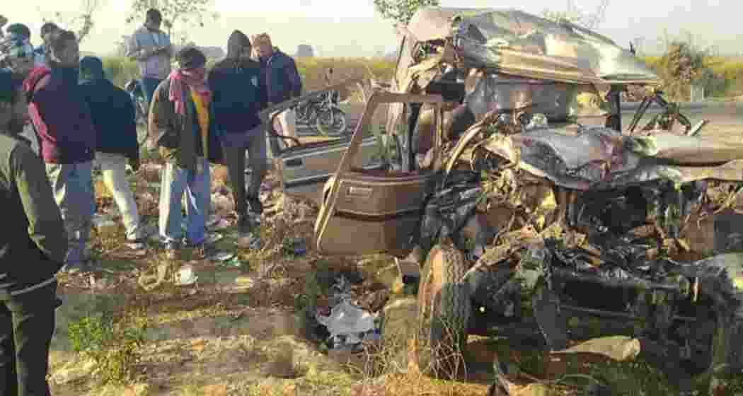 Bystanders at the accident site on the Prayagraj-Mirzapur highway, where a devastating collision claimed ten lives and left nineteen injured as devotees travelled to the Maha Kumbh Mela early on Saturday.