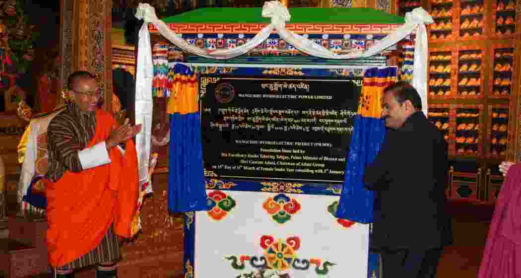 Adani with Bhutan Prime Minister Tshering Tobgay (L).