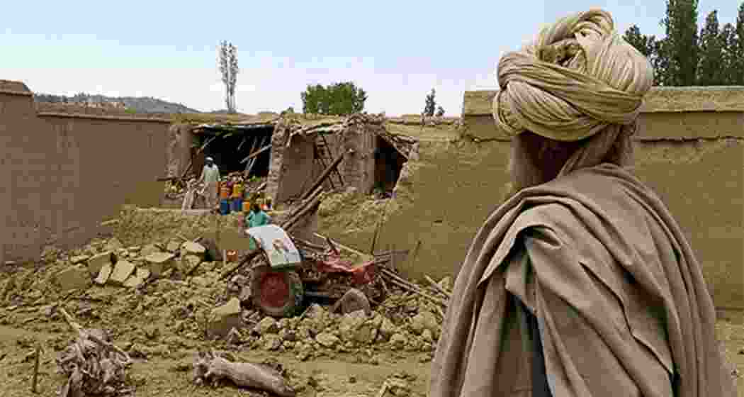 A man takes a look at the destruction left in the aftermath of the earthquake in Afghanistan on Monday.