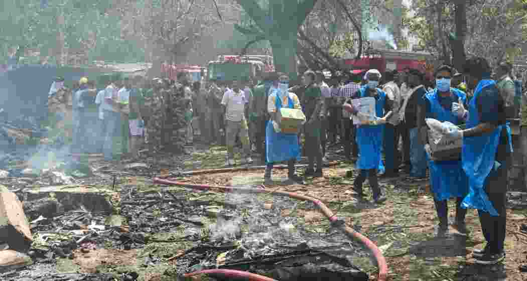 Rescue and relief work underway after an Air India plane crashed moments after taking off from the airport, in Ahmedabad, Thursday.