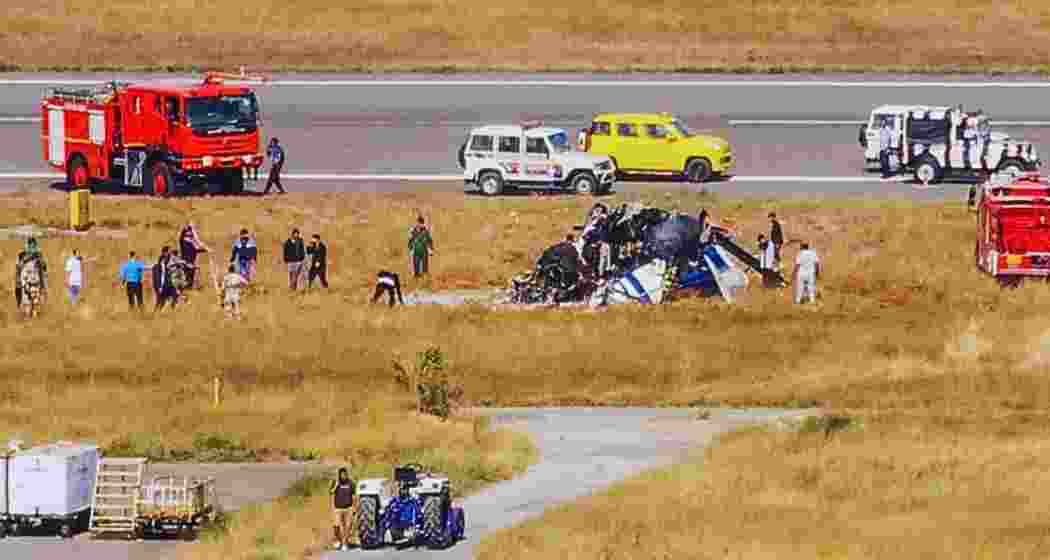 Rescue work underway after a helicopter of the Indian Coast Guard (ICG) crashed during landing at Porbandar airport in Gujarat on Sunday. Three crew members were killed in the incident, according to police. (PTI)